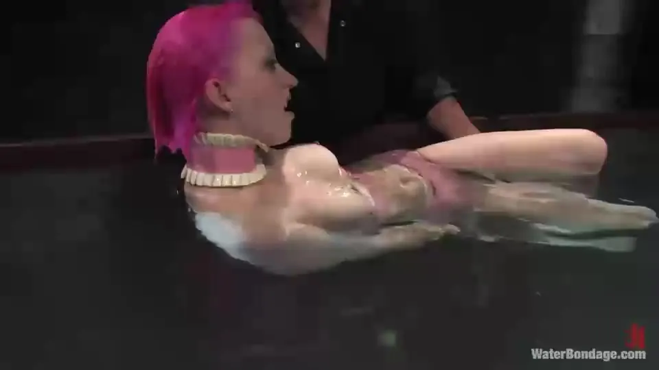 Drowning a pink-haired sex slave in cold water