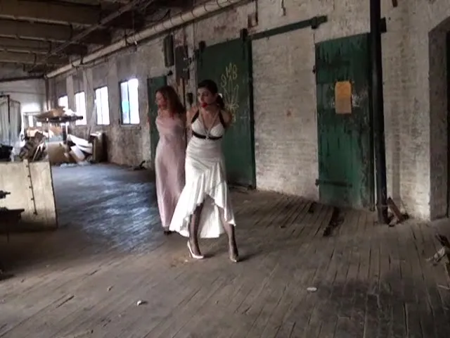 Two dress-wearing hoes aimlessly wonder around in search of escape