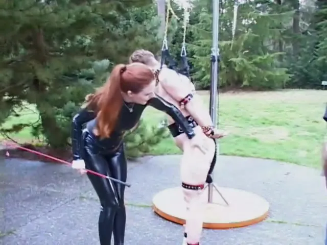 Sweet redhead Domina in leather suit humiliates her sub doll