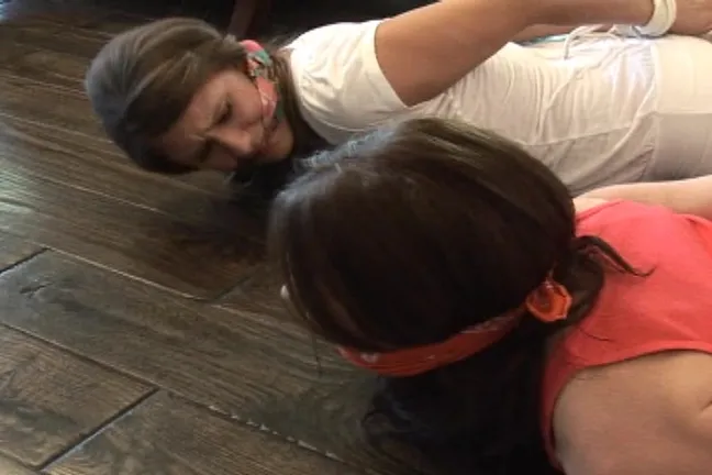 Sexy amateur wife and her sister are lying hogtied on the floor