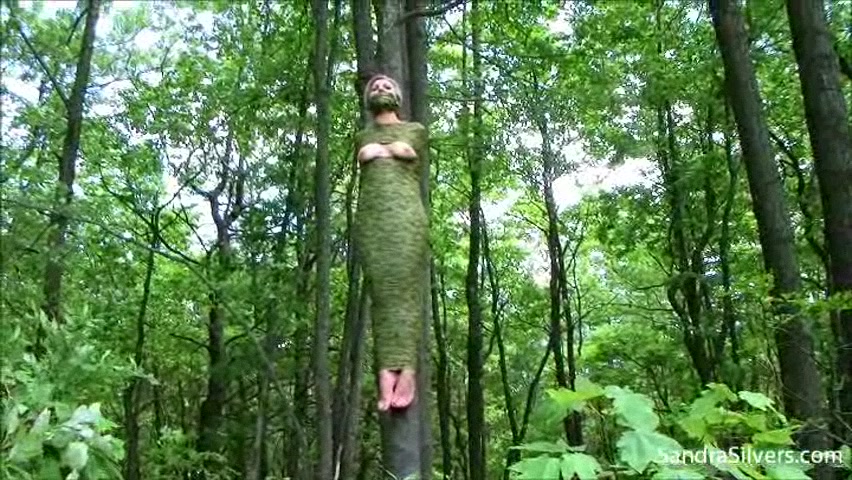 Extremely brutal and tight bondage for a big-tit doll in forest