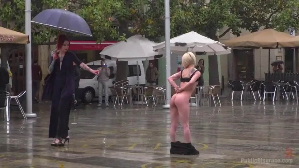 No umbrella for a naked slave in a public square, suffer, bitch