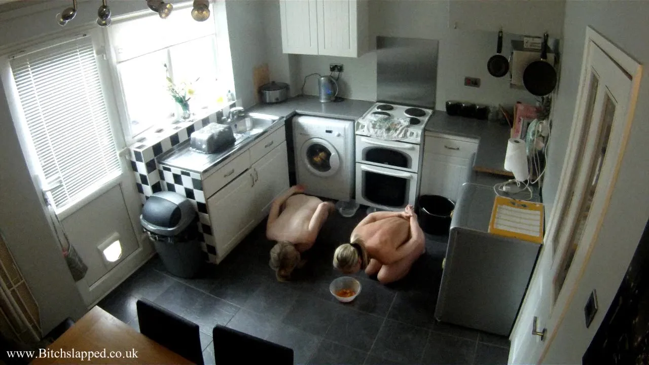 Two sub babes in handcuffs are both drinking from bowls