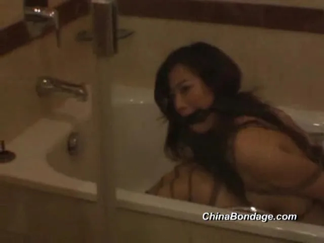 Angelic Asian brunette is getting humiliated and bounded in the bathroom