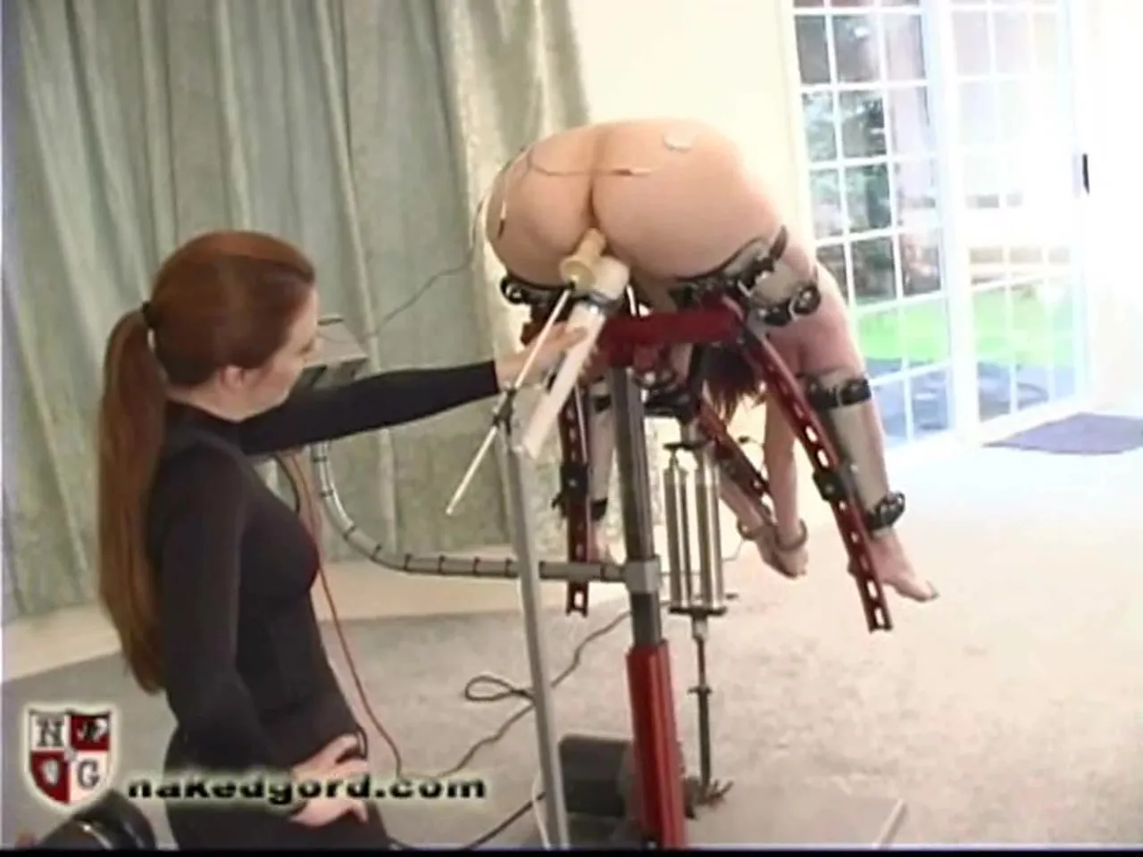 Mistress enjoying a machine fucking view of her helpless slave