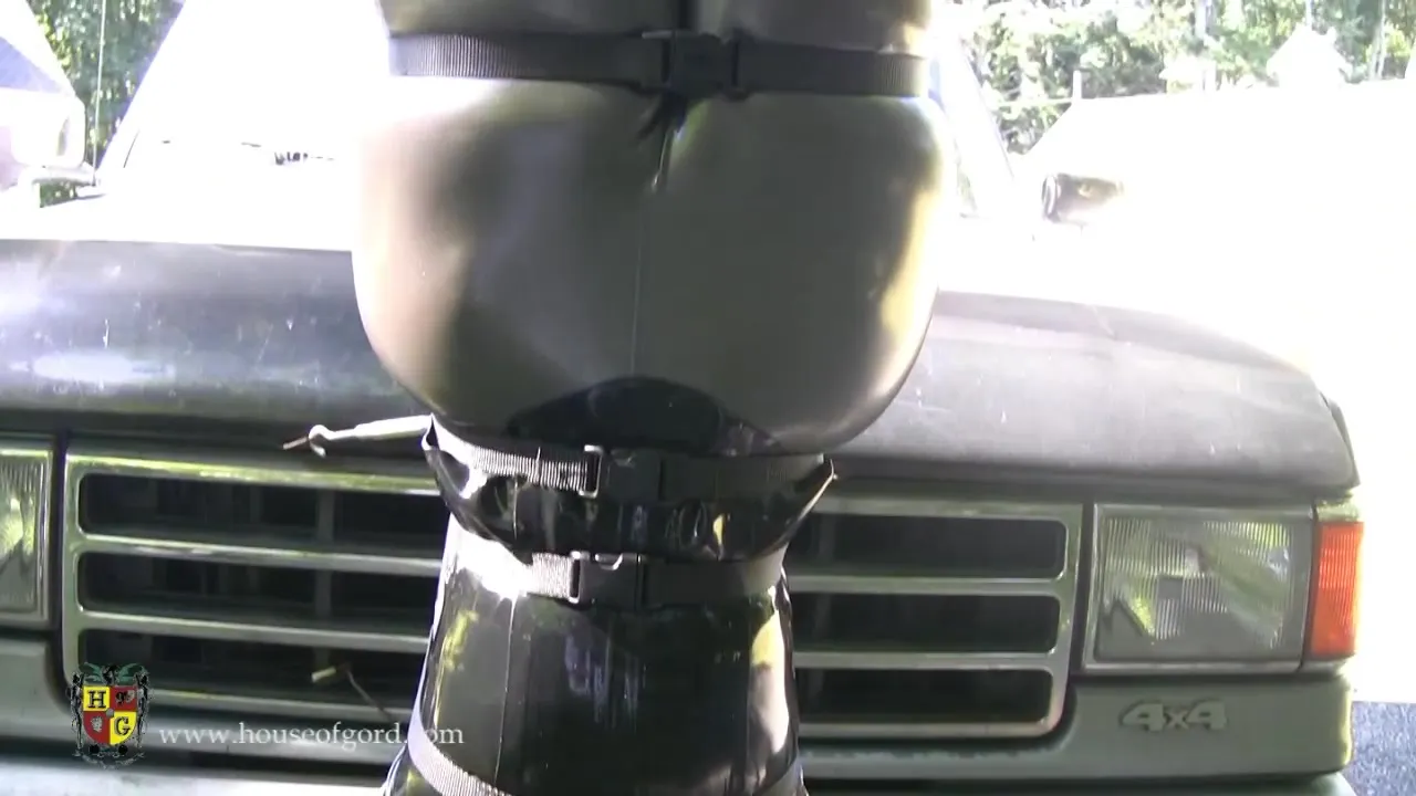 Man drives around a fully bound slut dressed in latex suit