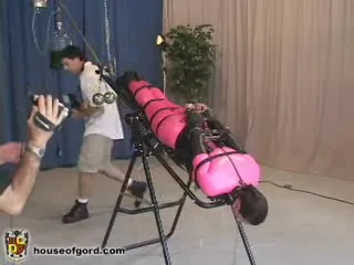 Curvy slut in tight costume suffers on centrifuge bench