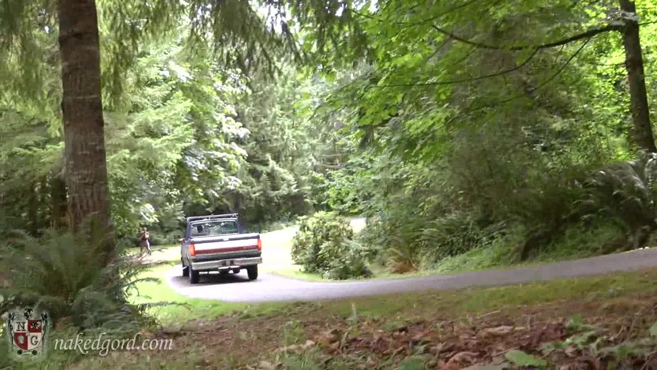 Naked slut attached to a truck gets a drive-around