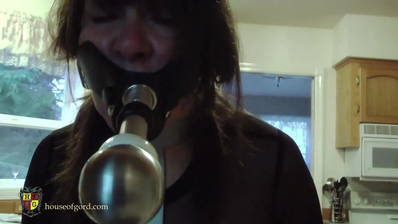 Stupid mature forced to clean the house with her mouth gag