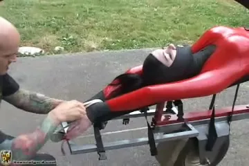 Slave takes a ride bound to a truck's trailer